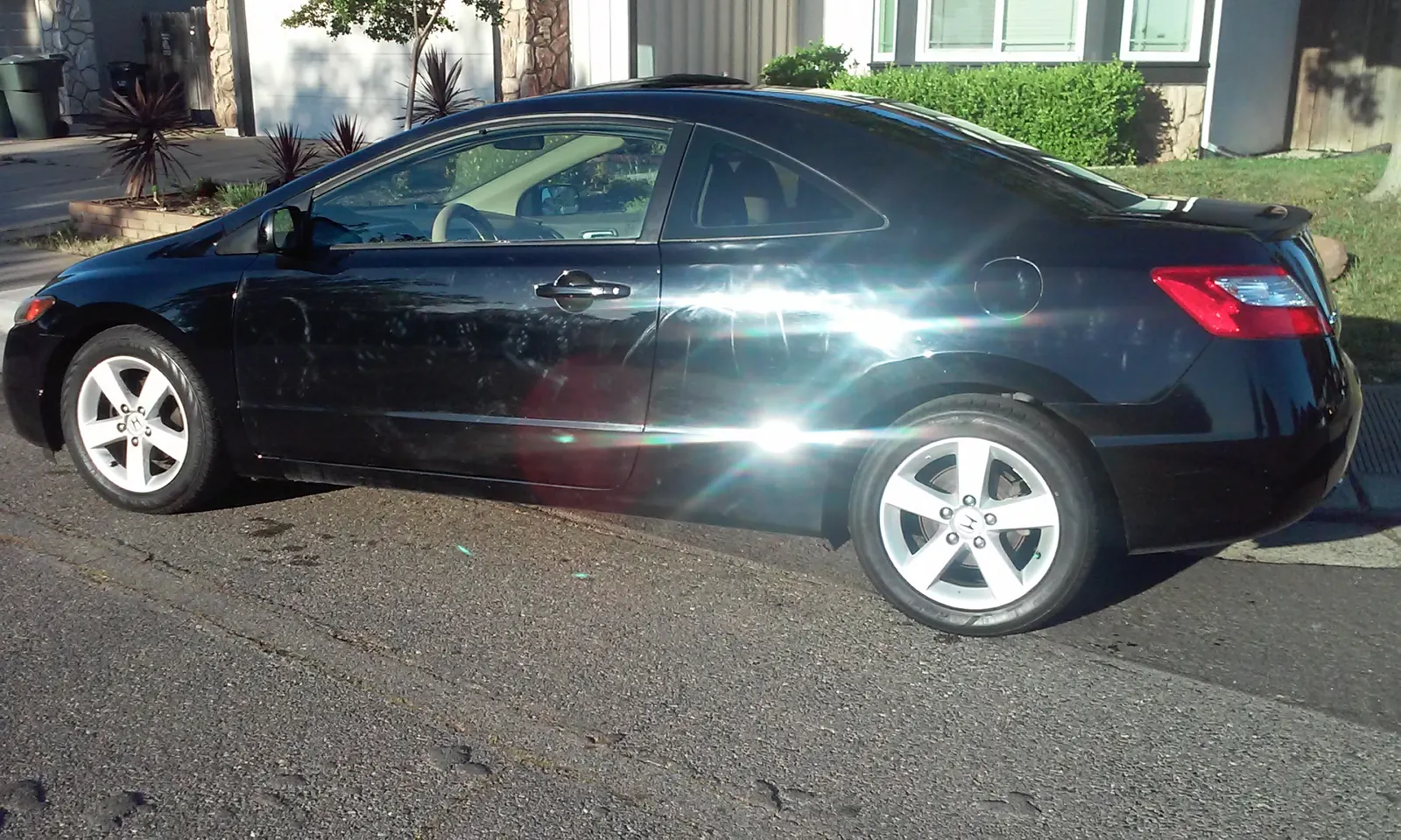 Black Honda Civic coupe, exterior detail
