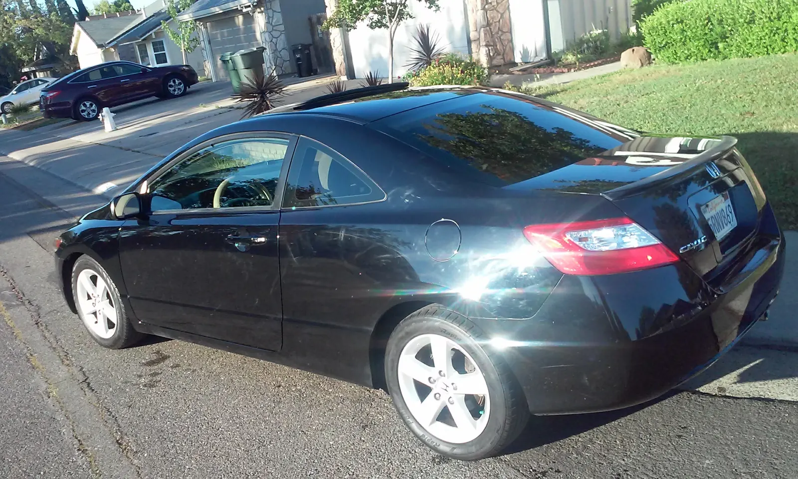 Black Honda Civic coupe, exterior detail