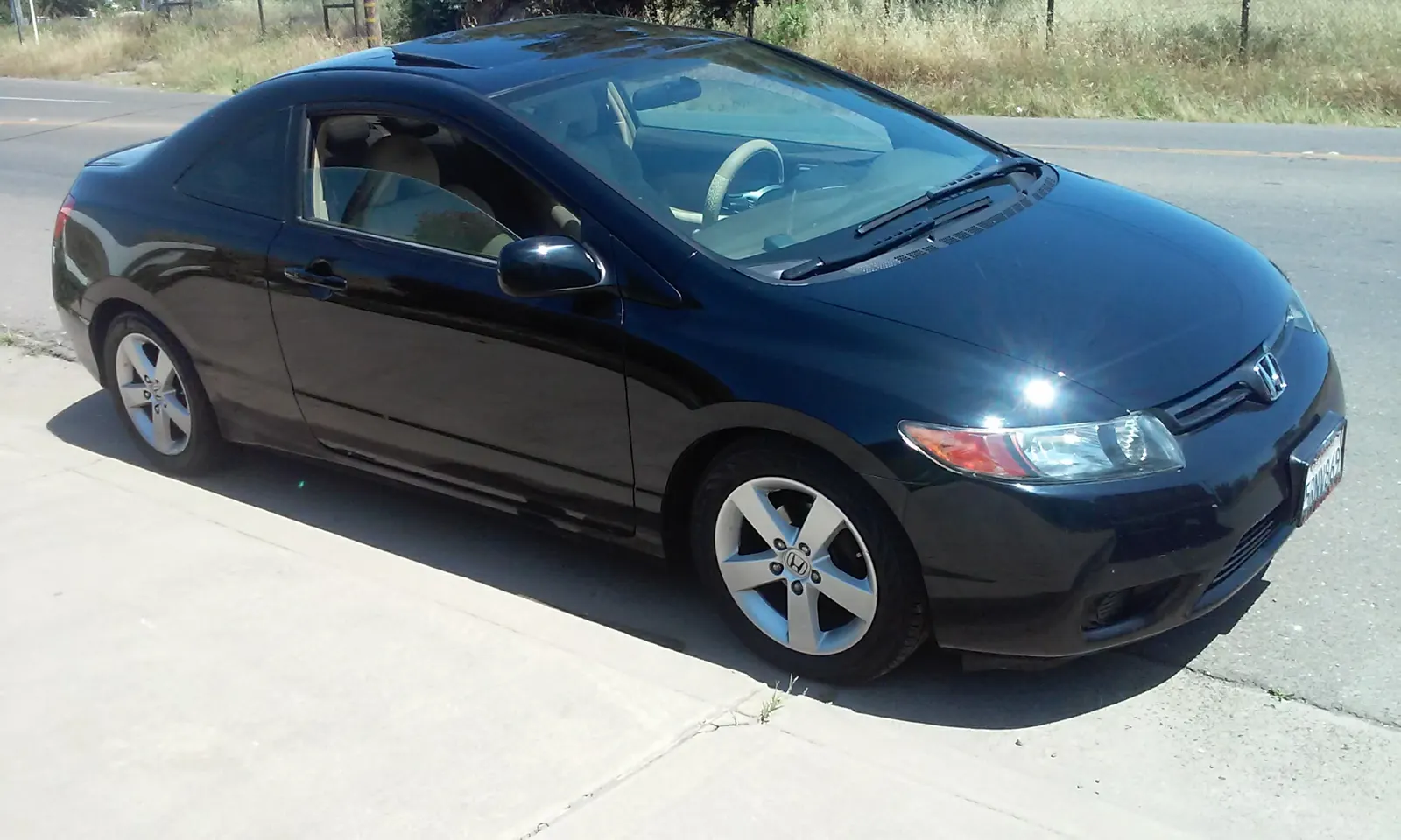 Black Honda Civic coupe, exterior detail