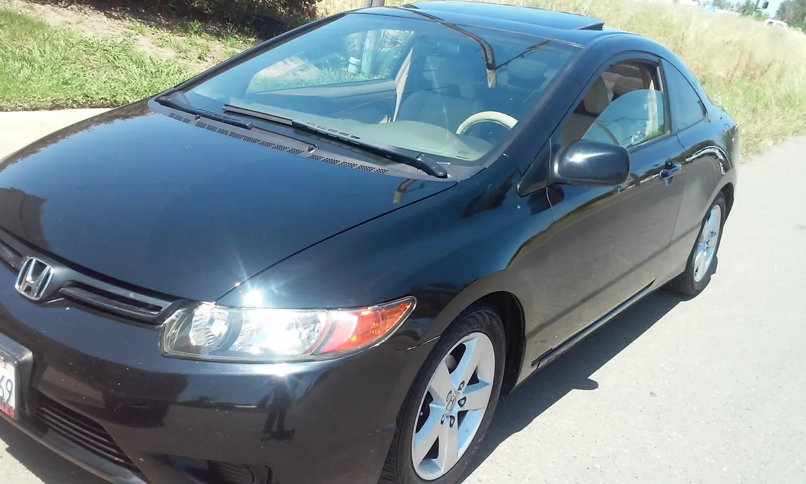 Black Honda Civic coupe, exterior detail