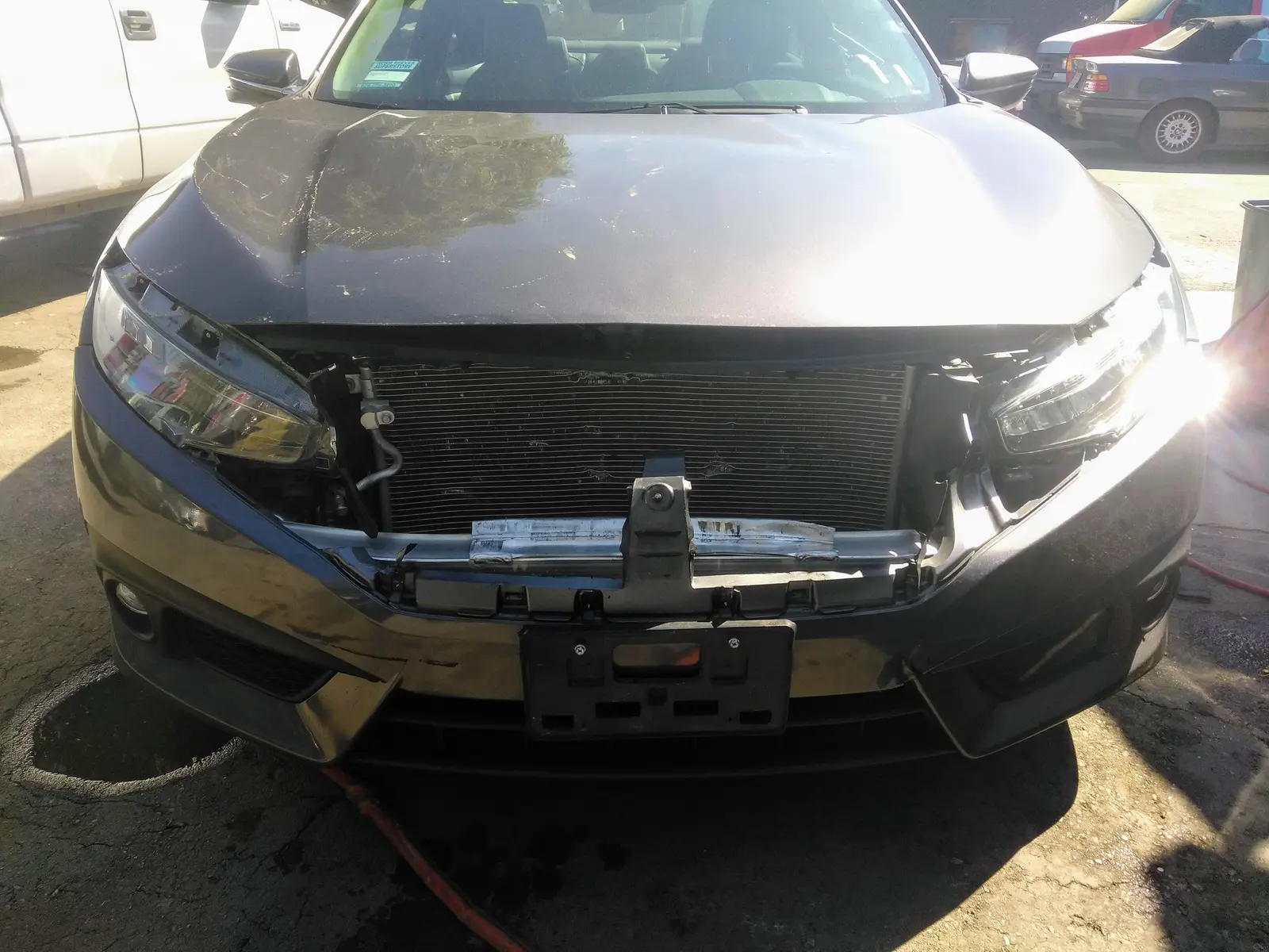 Gray Honda Civic, front-end collision repair