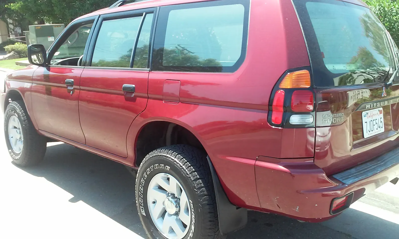 Red Mitsubishi Montero Sport, washed and detailed