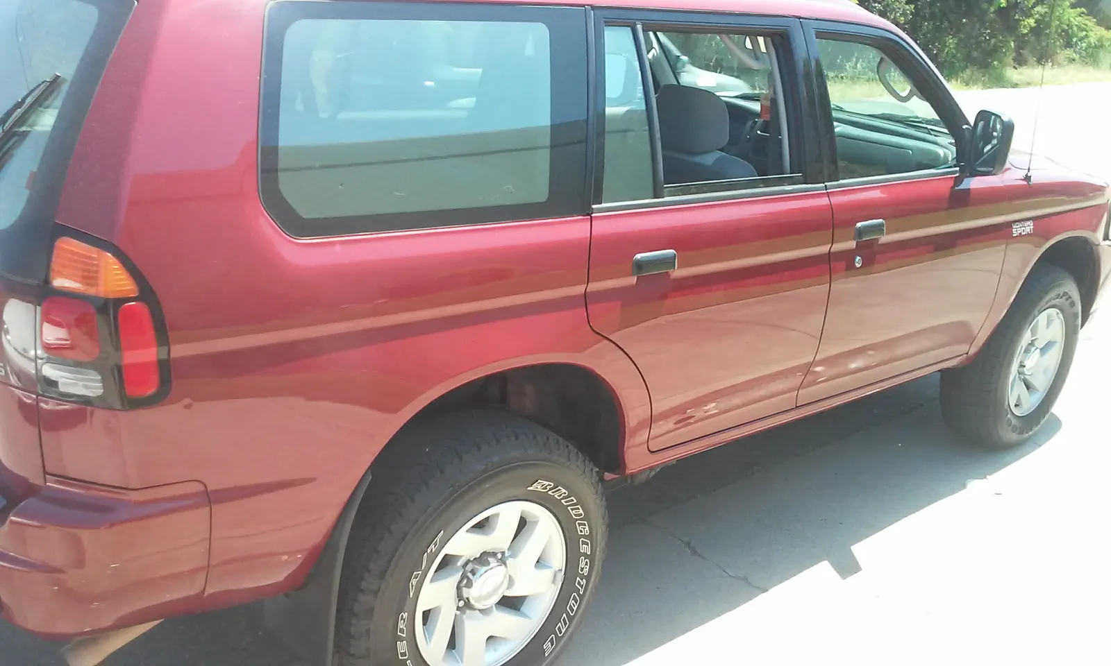 Red Mitsubishi Montero Sport, washed and detailed