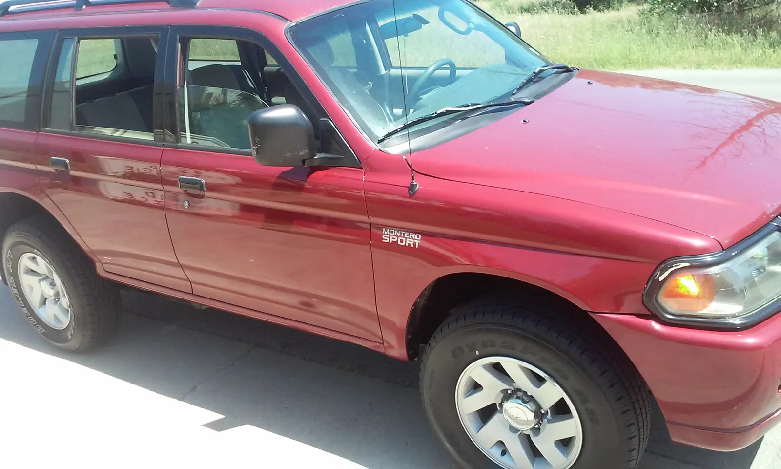 Red Mitsubishi Montero Sport, washed and detailed